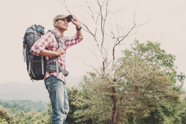 istock Hiking man traveling with backpack in mountains 1142166119