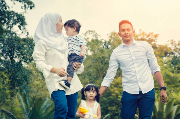 istock Parents Standing With Children 1142167086