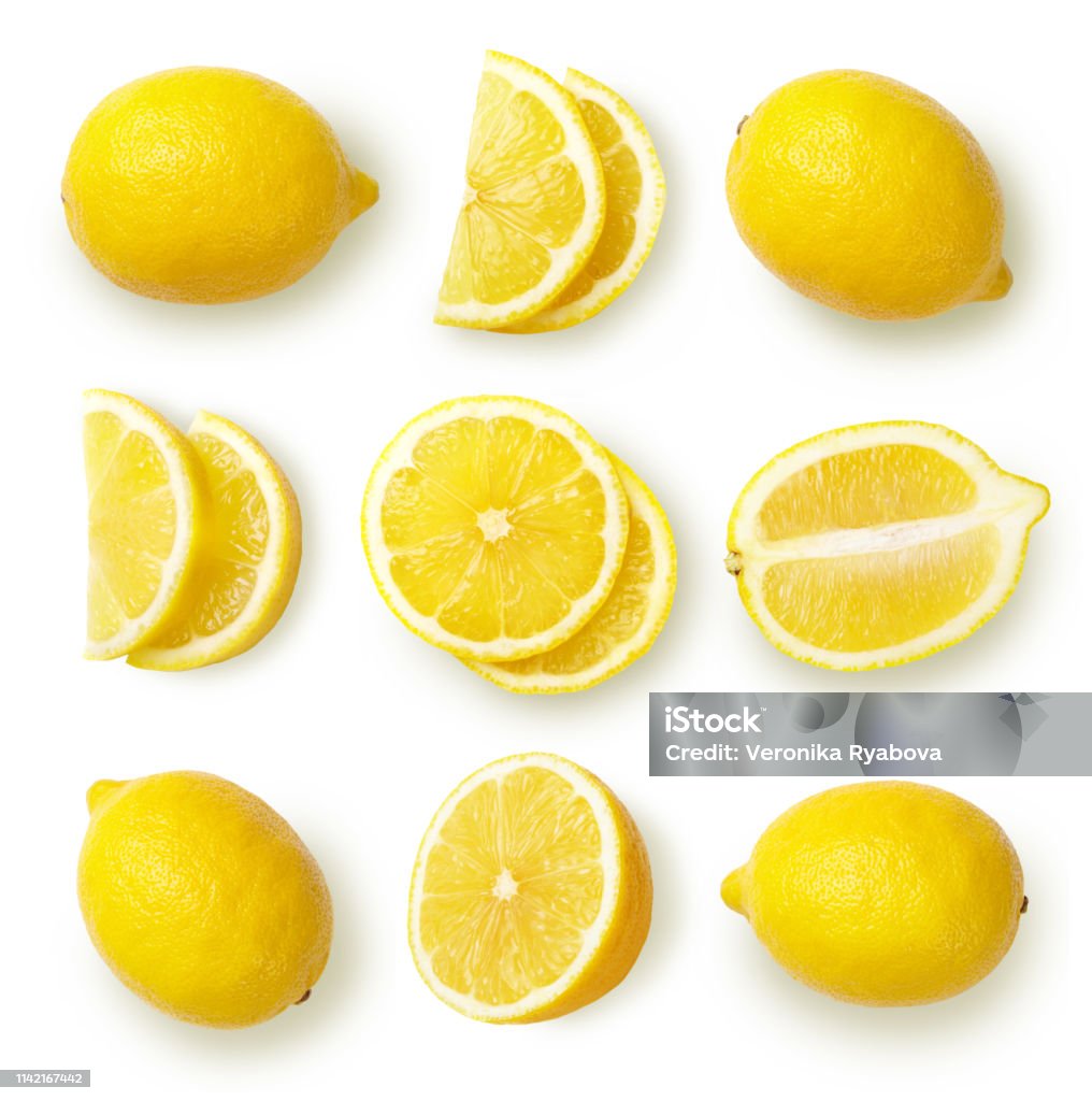 Lemons isolated on white background. Composition with whole and sliced lemons, cut out. Top view. Lemon - Fruit Stock Photo