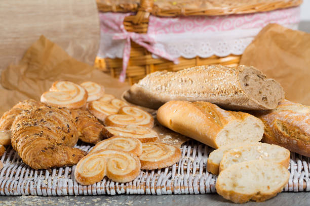 istock Various kinds of bread and  bakery products on table 1142168166