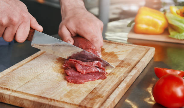istock Always fresh, never frozen. Chef preparing dish in commercial kitchen. Close up 1142169920