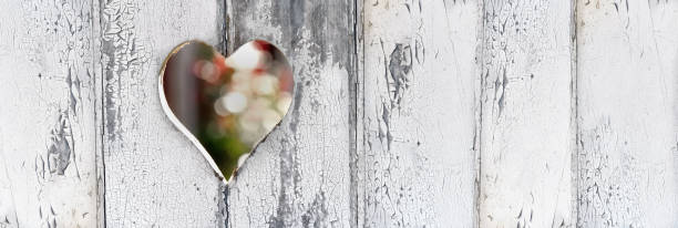istock heart-shaped hole on a door white paint defreshed 1142169963