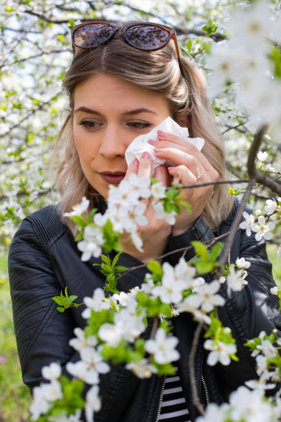 istock Allergic woman sneezing outdoor on springtime 1142177910