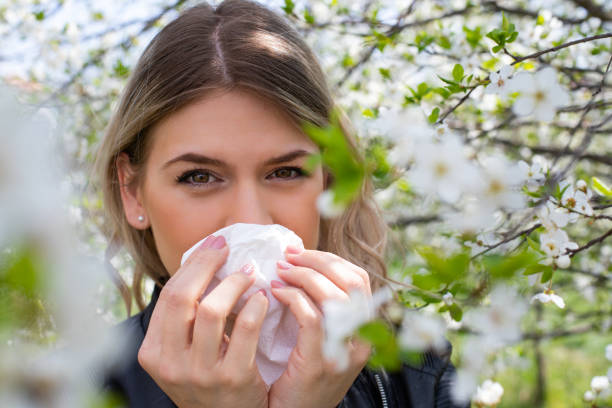 istock Allergic woman sneezing outdoor on springtime 1142177958