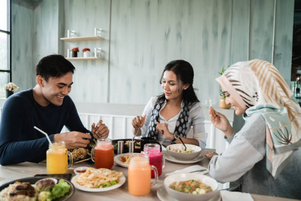 istock group of friends enjoy eating together 1142180939
