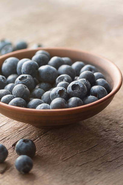 istock Fresh Blueberry on wooden background, close up 1142182856