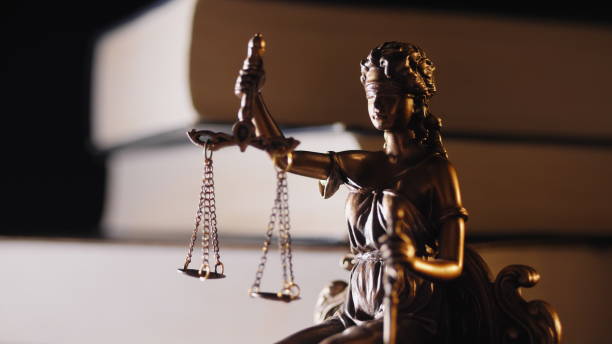 istock The Statue of Justice - Statuette, light and books 1142185411