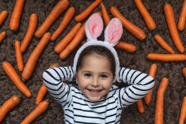 istock Cute girl with costume rabbit ears 1142185416