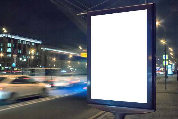 istock Blank lightbox at night with car lights in motion blur 1142186853