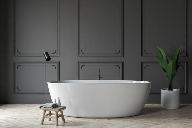 istock Gray bathroom interior, white tub 1142187127