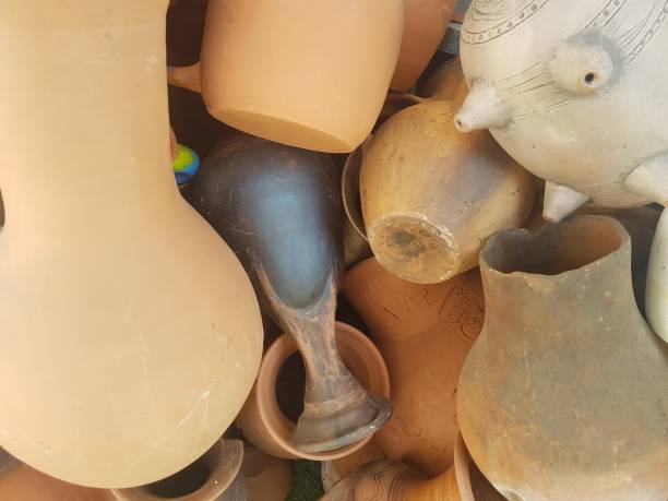 istock Clay pots of different color in pile, background texture. 1142187348