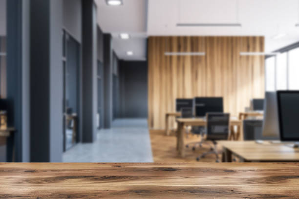 istock Wooden and gray open space office blur 1142188930