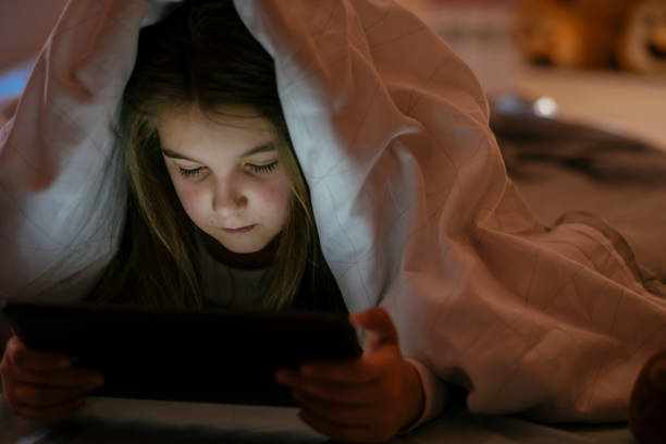 istock Watching her favorite cartoons before bed 1142190636