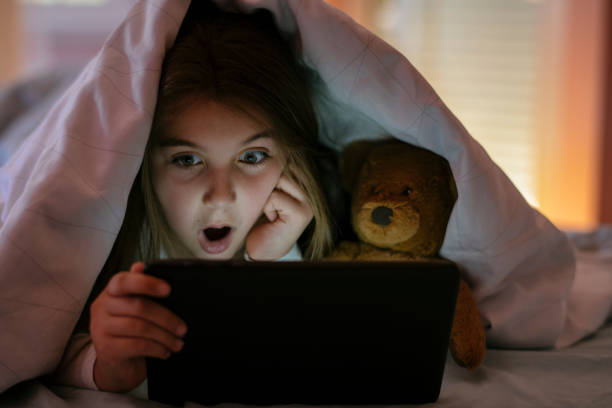 istock Watching her favorite cartoons before bed 1142190678