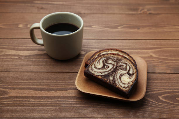 istock black hot coffee and marble chocolate pound cake isolated on wood table 1142190894