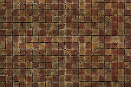 Old yellow and red square brick mosaic tiles texture background. Brick tiles wall.