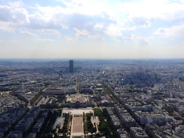istock Champ de Mars view from top of eiffel tower looking down see the entire city as a beautiful classic architecture. A romantic place for lovers and family to visit. 1142192716