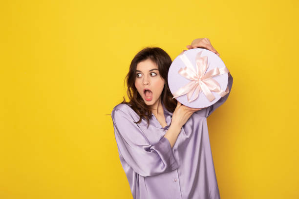 istock Very surprised girl showing festive present box 1142195660