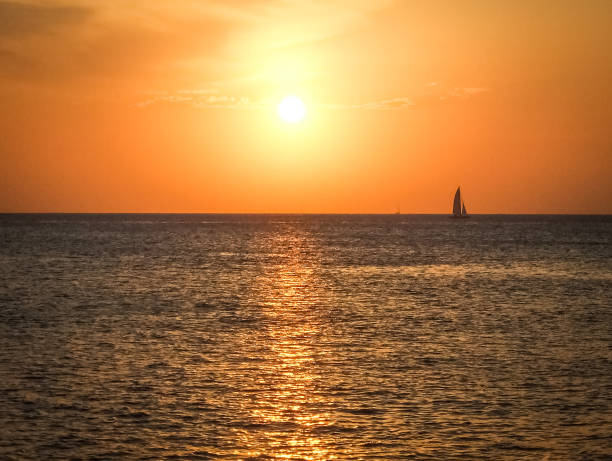 istock boat on the horizon at nightfall in Ibiza 1142195768