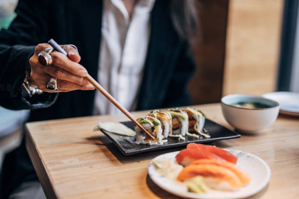 istock Man enjoying in sushi 1142196212