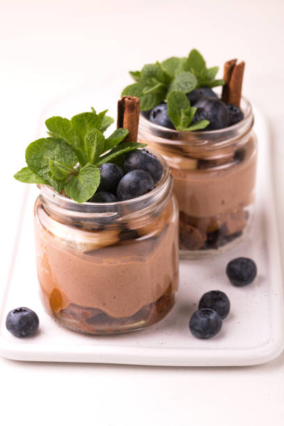 istock Cake dessert. Chocolate mousse with blueberry, mint and cinnamon 1142196377