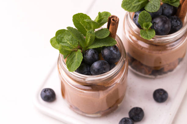 istock Cake dessert. Chocolate mousse with blueberry, mint and cinnamon 1142198031