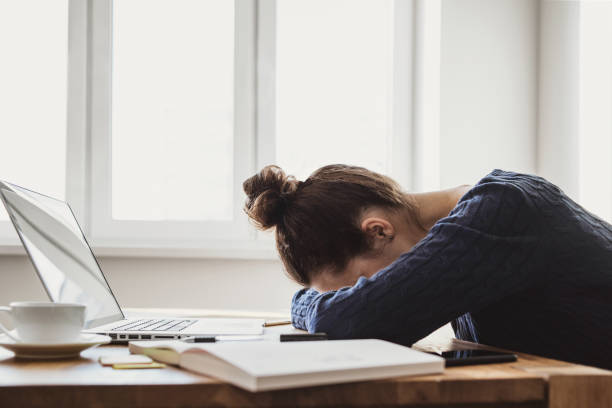 Tired and overworked business woman Girl sleeping during work at the office exhaustion stock pictures, royalty-free photos & images