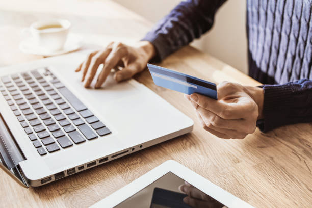 istock Woman using internet banking with laptop and credit card 1142199057