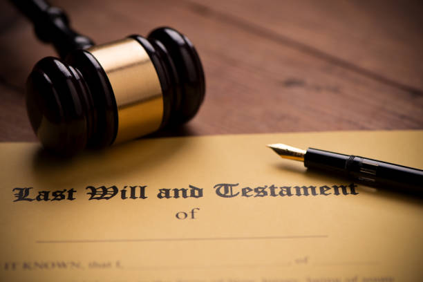 istock Last will and testament form with gavel. Decision, financial 1142199691