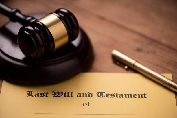 istock Last will and testament form with gavel. Decision, financial 1142200409