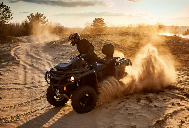 istock Racing in the sand on a four-wheel drive quad. 1142200437
