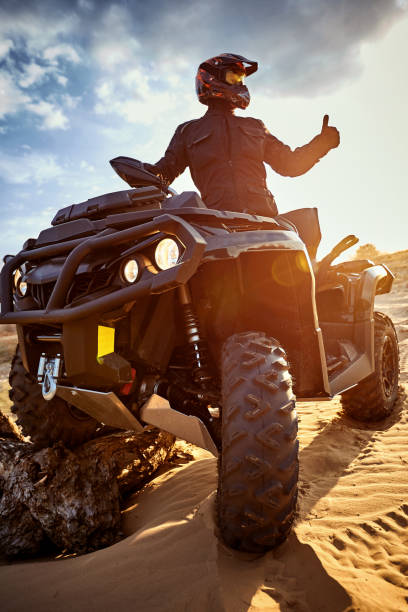 istock Racing in the sand on a four-wheel drive quad. 1142200447