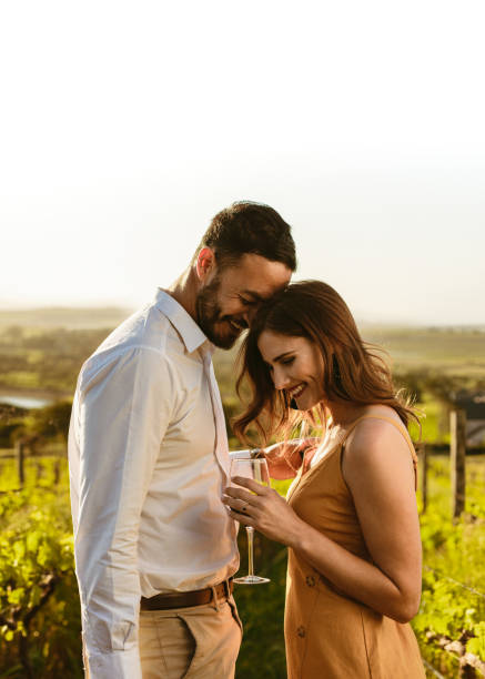 istock Romantic couple standing together in a vineyard 1142201938