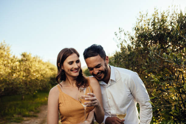 istock Romantic couple walking in a wine farm 1142201958