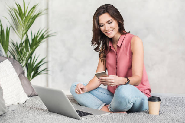 istock Beautiful freelancer woman using laptop computer at home 1142202165