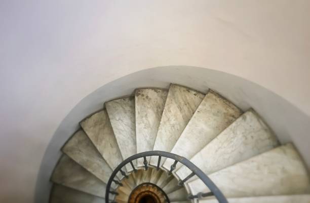 istock Partial view of an ancient spiral staircase 1142205702