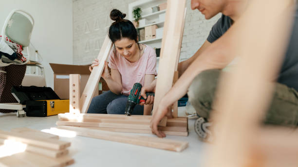 istock Couple assembling furniture together 1142206297
