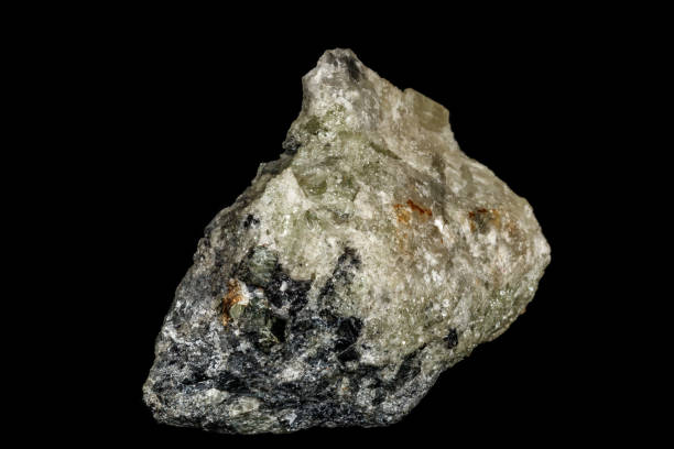 istock Macro stone Apatite and magnetite mineral on parade on black background 1142206347