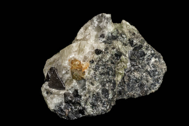 istock Macro stone Apatite and magnetite mineral on parade on black background 1142206364