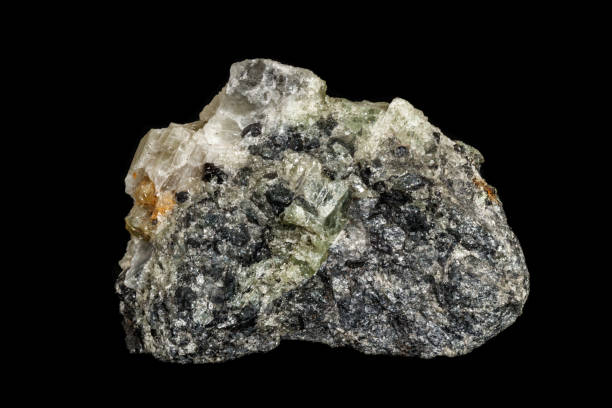 istock Macro stone Apatite and magnetite mineral on parade on black background 1142207059