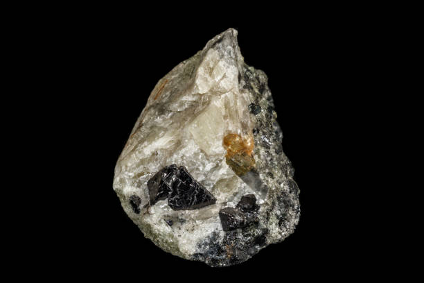 istock Macro stone Apatite and magnetite mineral on parade on black background 1142207179
