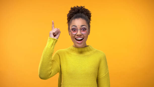 istock Smart black woman raising finger up, new creative idea, scientific discovery 1142207604