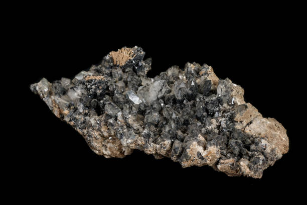 istock Macro stone mineral Quartz with ilvayit on a black background 1142207640