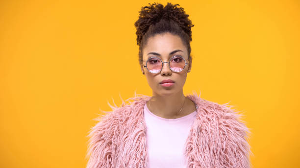 istock Female millennial in stylish cloth looking in camera on bright background, model 1142207687