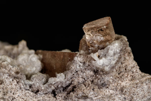 istock Macro stone Topaz mineral in rock on a black background 1142207854