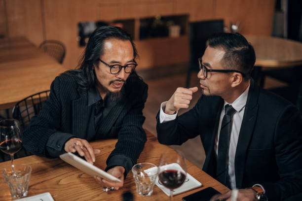 istock Chinese businessmen in restaurant 1142212032