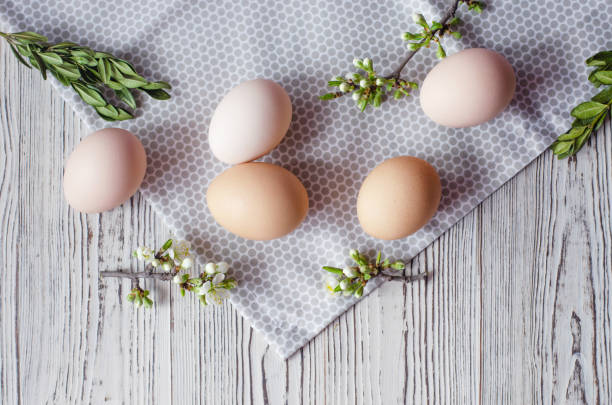 istock Easter composition of eggs, green twigs and napkins. 1142212603