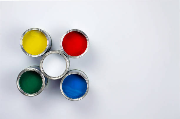 istock Five cans of multicolored paint on a white background. 1142212664