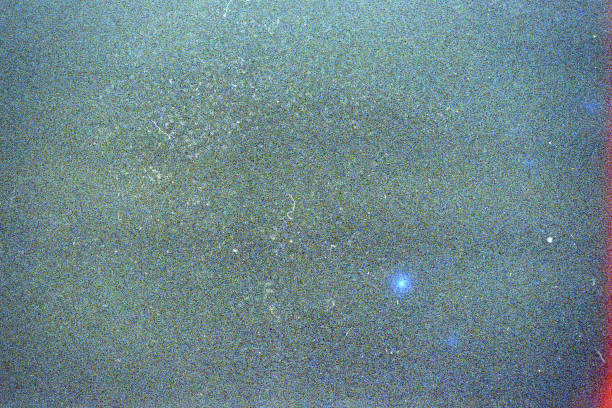 istock Noisy blue film frame with scratches, dust and grain 1142212708