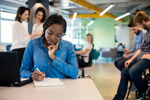 istock Young African woman in modern office 1142212803